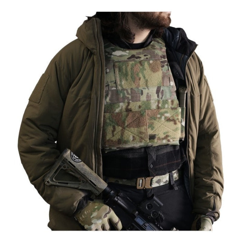 Photo of the Ferro Concepts Slickster Plate Carrier worn hidden under a shirt demonstrating its slim low-profile fit for covert daily carry. The lightweight minimalist design with an elastic cummerbund stays flat against the body for discreet protection and comfort, making it ideal for undercover law enforcement, plainclothes security details, and low-visibility tactical operations