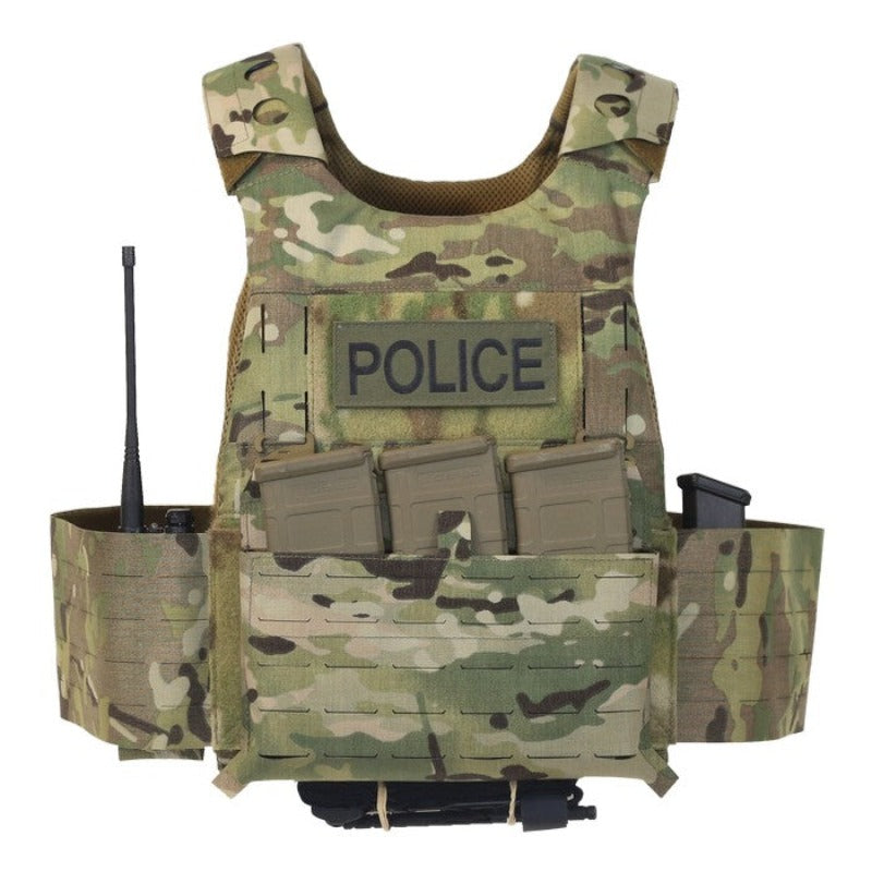 Photo of the Ferro Concepts Slickster Plate Carrier in MultiCam fully loaded with mission-essential pouches, radio, and magazine inserts for everyday tactical use and professional work kit. Shows how the minimalist carrier supports a modular loadout with the elastic cummerbund, laser-cut slots for ADAPT accessories, and loop Velcro for ID patches. Trusted by law enforcement, security, and covert operators for flexible combat-ready performance