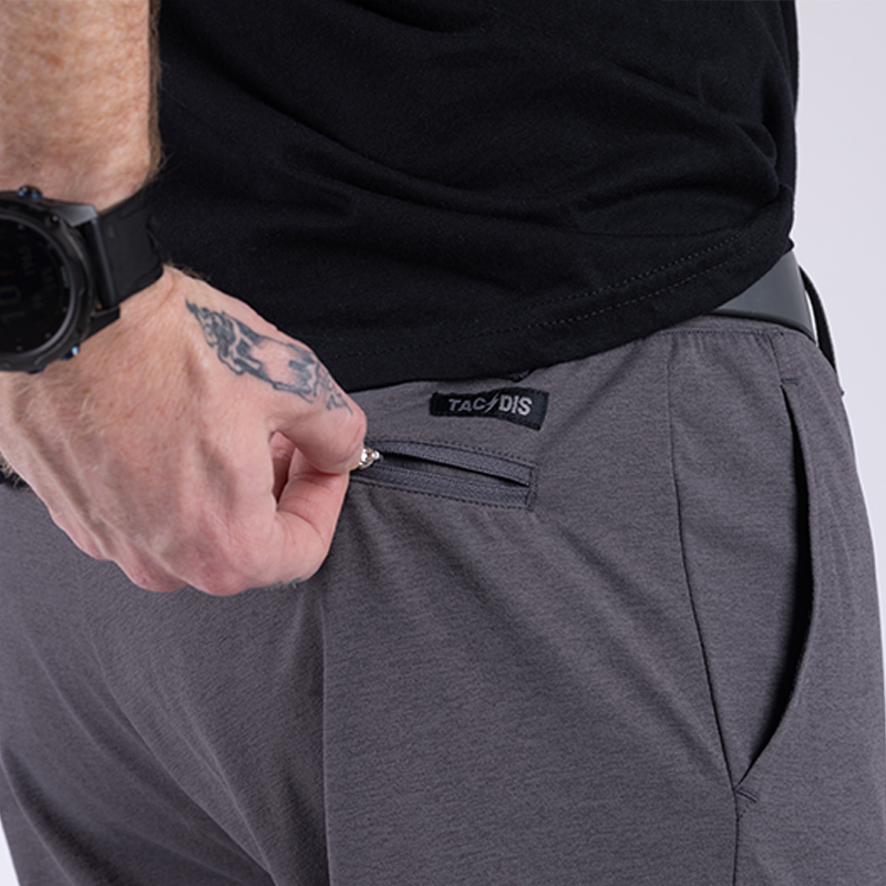 Close-up of the low-profile zippered back pocket on TD Tactical EDC Joggers in Gunmetal Grey, designed for secure storage and everyday carry utility