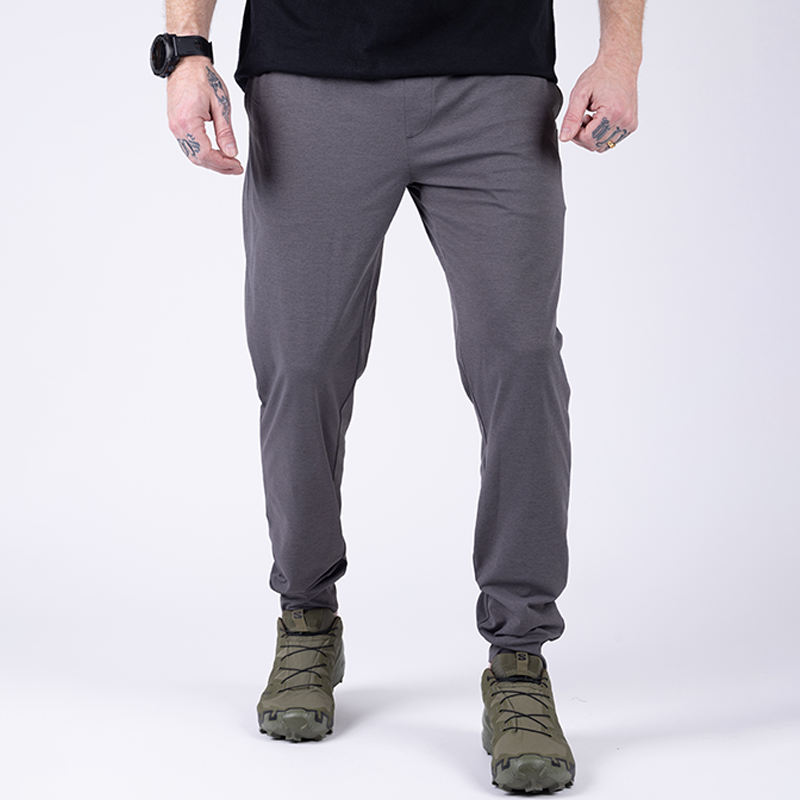 Front action view of TD Tactical EDC Joggers in Gunmetal Grey demonstrating flexible stretch fabric and full mobility for tactical movement, training, and off-duty comfort.